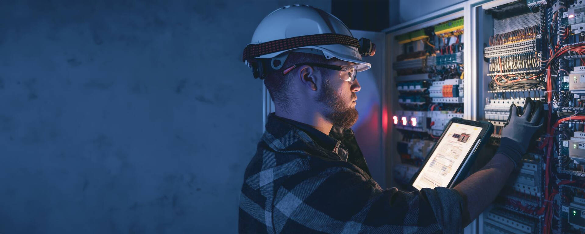 Professional electrician carrying out commercial electrical installation in West Yorkshire